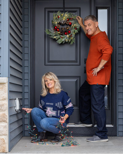 Pete and Megan from Powerhouse hanging Christmas lights