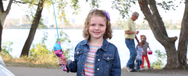 Little girl with fishing rod