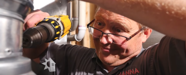 Man installing a water heater