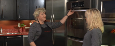 Woman opening oven