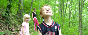 Kids walking in the woods